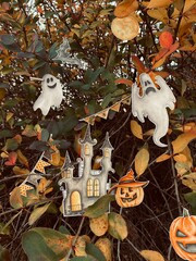 Happy Halloween photography. Cute autumn Halloween photo. Carved pumpkins, ghost, castle, moon, bat, autumn leaves. Fall, autumn, October. For invitations, cards, stickers, blogs.