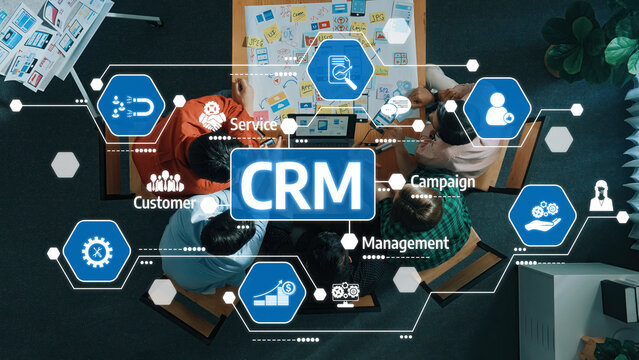 A diverse team collaborates on a customer relationship management strategy while utilizing digital tools and visual icons to enhance service and campaign effectiveness. Amity