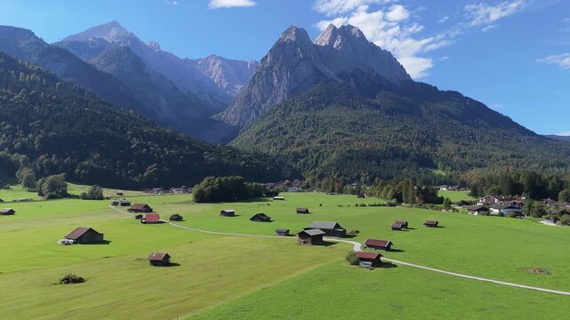 Drone Aerial View of Garmisch-Partenkirchen Alpine Landscape with Meadows and Mountains