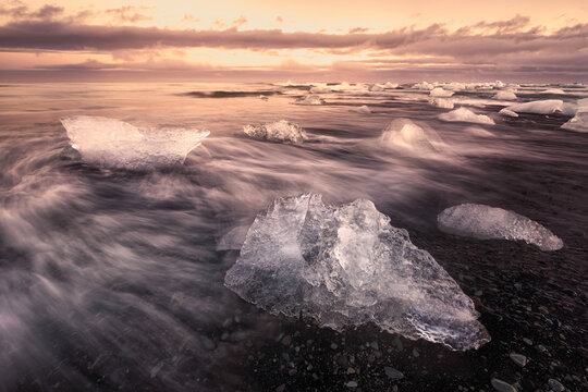 Close-up of dramatic ice formations on these shore of a black sand beach and Glacier Lagoon, Vatnajokull National Park, Iceland