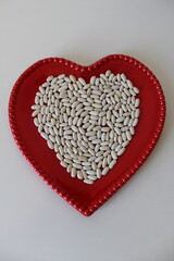 Detail of white beans on a white background.
