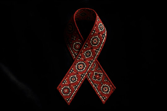 Ajrak Fabric Red Ribbon on Velvet Background