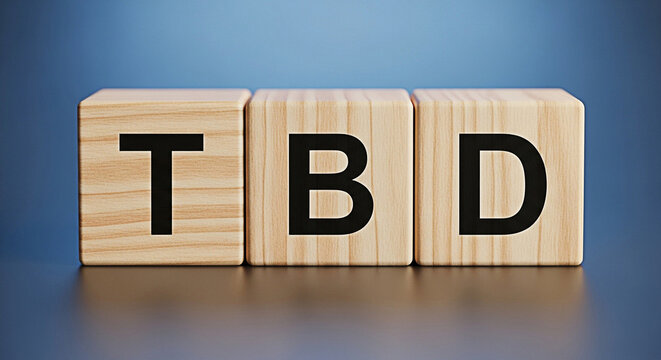 Wooden blocks spelling tbd to be determined concept on a blue background for business and planning 100