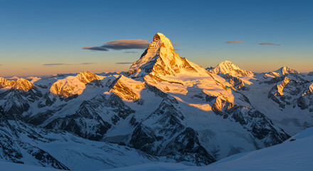 Matterhorn mountain peak with snow and blue sky