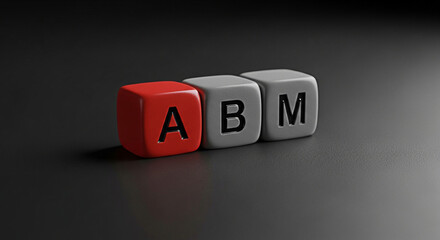 Account based marketing concept shown with abm letters on colorful dice against dark background