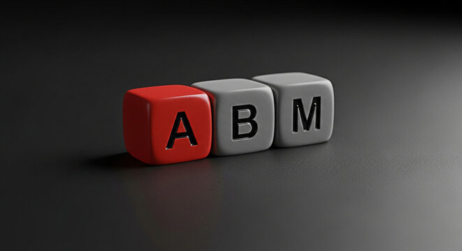 Account based marketing concept shown with abm letters on colorful dice against dark background
