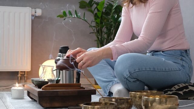 Woman enjoy tea ceremony at home and meditative atmosphere