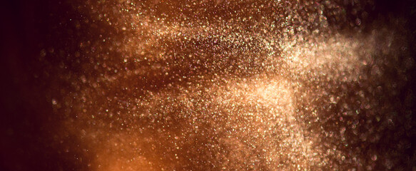 Gold particles floating holiday abstract background, Liquid gold, golden art backdrop. Beautiful metallic dust yellow texture, Metallic paint close-up. Art Wallpaper waves surface  