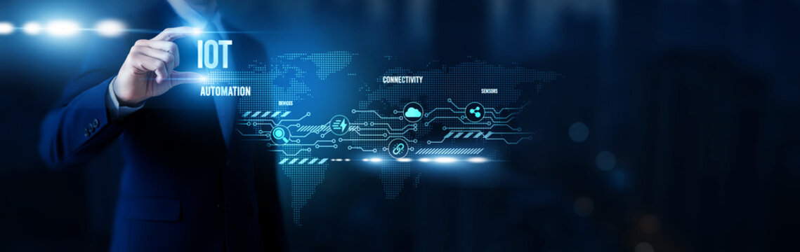 Businessman hold word IoT, internet of things platforms, connected devices, sensor-enabled automation, smart enterprise ecosystems and global network.