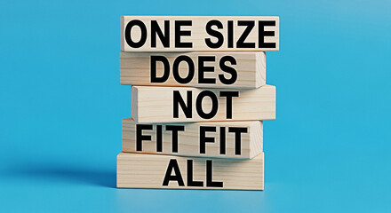 Wooden blocks stacked with one size does not fit all text on a bright blue background concept of uniqueness