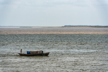 Obraz premium The meeting of the blue waters of the Tapajos River and muddy of the Amazon River in Santarem, Para State, Brazil.