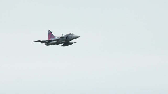 JAS-39C Gripen soars through the cloudy sky during a test flight