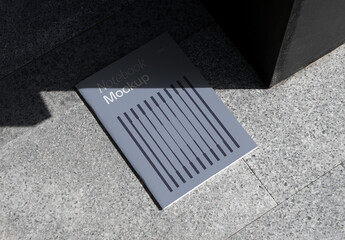 Lying on Concrete Notebook Mockup