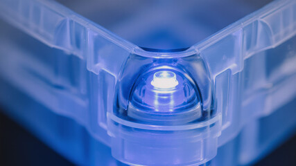 High tech scanning component glowing blue inside transparent logistics device module