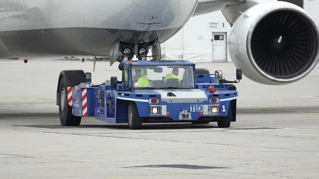 Preparing a passenger plane for departure at the busy airport