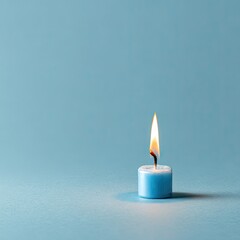 A single, lit, light-blue candle on a smooth, pale-blue surface