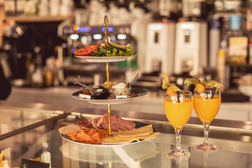 Brunch features vibrant charcuterie platter and refreshing drinks in charming cafe setting