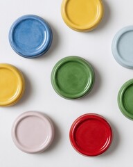 Row of colorful ceramic plates with different shades
