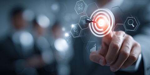 Businessperson's finger pointing to a digital target with overlayed data, business strategy, or technology concept