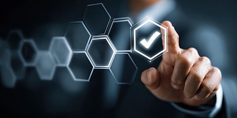 Businessperson's hand touches a glowing hexagonal interface with a checkmark, suggesting approval or completion of a digital task