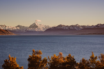 Lake Pukaki and Mount Cook with Autumn Colors and Lenticular Cloud at Sunrise, New Zealand