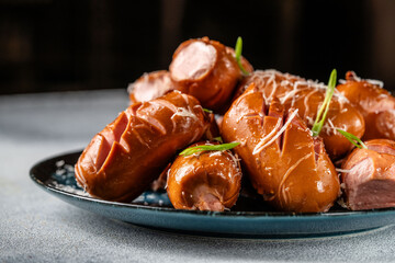 Grilled sausages with herbs and cheese