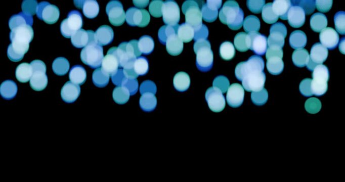 Part&iacute;culas bokeh azuis/ciano flutuando sobre fundo preto. Loop cont&iacute;nuo em 4K com movimento suave