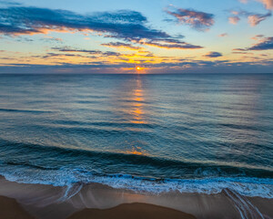 Sunrise Seascape Over Gentle Ocean Swells
