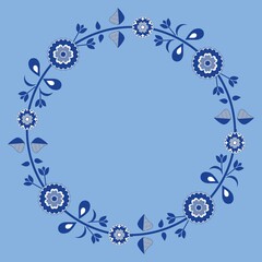 Round frame decorated with flowers.