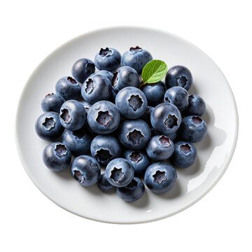Pile of ripe blueberries on a white plate. Top view. Healthy food