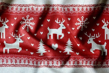 Seamless red Christmas fabric pattern with knitted texture, pixel-style festive design for holiday backgrounds, textiles. Cozy and traditional Christmas background evokes warmth and winter charm.