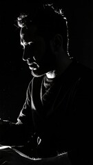 Dramatic Black and White Portrait of a Man in Silhouette with Focused Expression