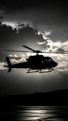 Dramatic Monochrome: Silhouette of a Helicopter Against a Cloud-Strewn Sky
