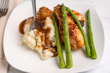 chicken  drumsticks  with asparagus and mashed potatoes