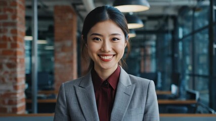 A professional and friendly businesswoman in a modern office setting, smiling and looking confident. - Powered by Adobe