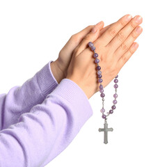 Hands clasped in prayer, holding a rosary with amethyst beads and a silver cross isolated on a transparent background.