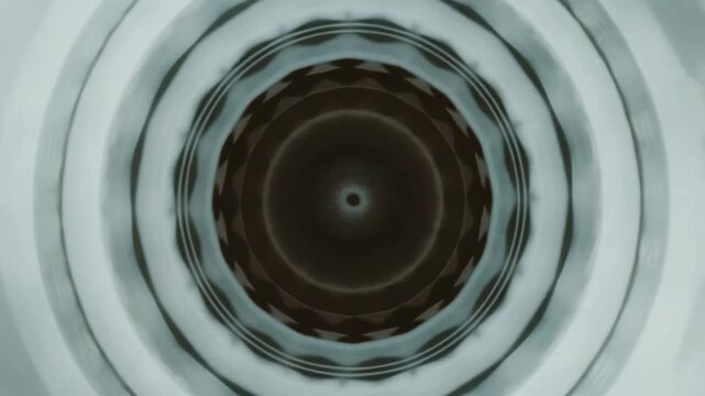 This is a black and white showcasing concentric circles that create an intriguing pattern in the center. The has been edited to give it a vintage effect, lending it an artistic touch.