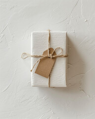 Minimal product mockup holiday flat lay, single gift box and tag, clean white background, soft shadow, copy space Christmas, ecommerce neutral product image gift exchange party holiday shopping