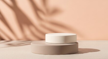 Stacked matte ceramic podiums in taupe and ivory with leafy shadows, natural daylight product styling for minimalist ads