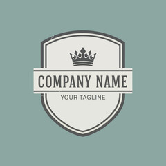Classic Shield Logo with Crown, Company Name Banner, and Distressed Texture for Brand Identity on a Muted Teal Background, Flat Vector Elements, Vector Illustration, Simple Vector, Stylized Vector