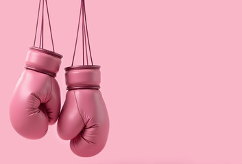 Pink boxing gloves on pink background, breast cancer awareness and sport