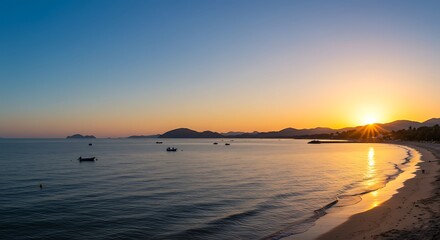 Serene coastal sunset view with ocean beach boats and mountain silhouettes