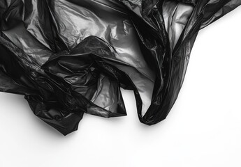 Crumpled Black Plastic On White Surface