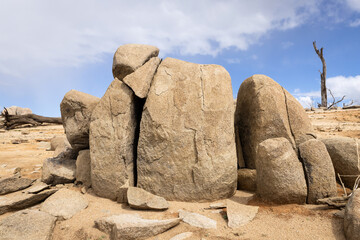 A surreal large cracked boulder formation captured on the shores of Lake Eucumbene in the Snowy Mountains.