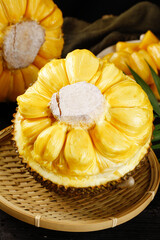 Fresh Thai Jackfruit Cut Open Showing Yellow Flesh Segments in Bamboo Basket - Tropical Asian Fruit from Thailand