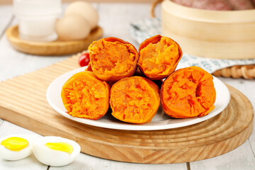 Fresh Roasted Sweet Potatoes with Orange Flesh on Wooden Board - Healthy Natural Food Ingredients