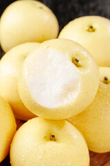 Fresh White Asian Pears with Peeled Fruit Showing Translucent Flesh