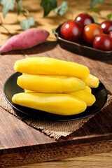 Fresh Small Yellow Potatoes Ready for Cooking with Vegetables on Rustic Wooden Background