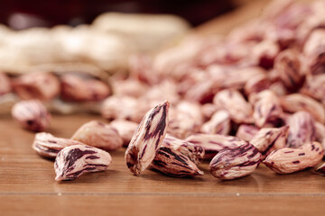 Colorful Borlotti Beans on Wooden Table with Burlap Sack - Fresh Legume Harvest