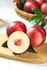 Fresh Australian Nectarines Cut in Half Showing Sweet Pulp on Wooden Board